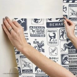 Jurassic World Dominion Signs Peel And Stick Wallpaper Tan/Blue - RoomMates -Children Furniture Store GUEST 9bebc459 3c57 4555 b27b e4e156778ae1