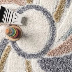 Theodora Colorful Swirl Kids Tassel Area Rug -Children Furniture Store GUEST fcf6084c b223 49a0 95d2 c926dd45af18